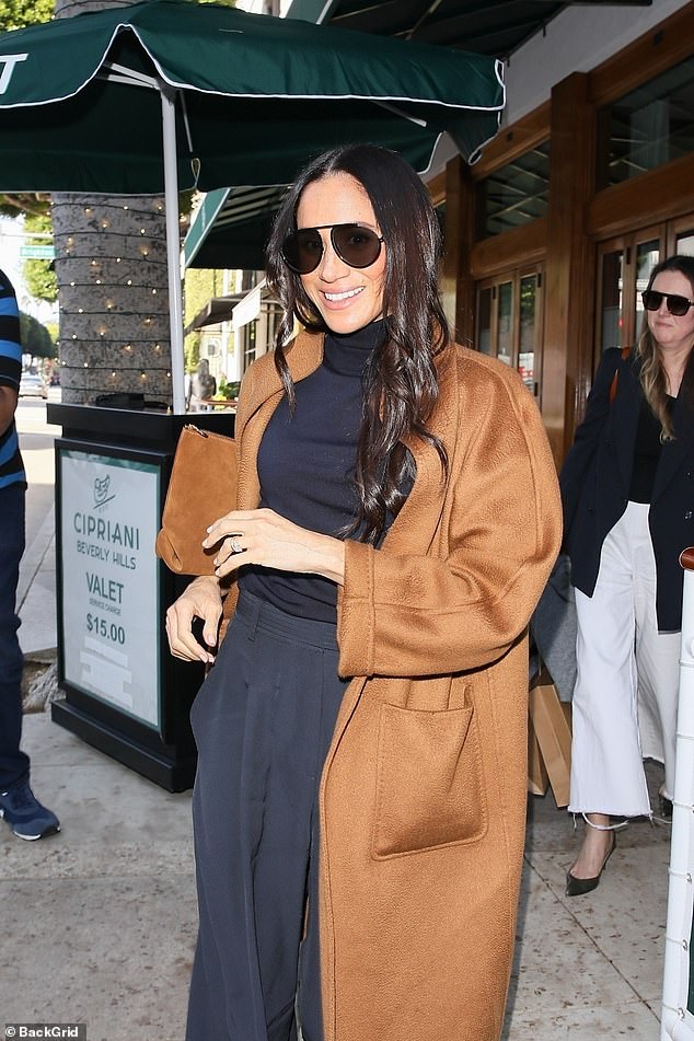 The Suits star, 42, turned Duchess of Sussex, showed off a winning, casual look in a black sweater and baggy pants as she was spotted leaving the Italian restaurant.