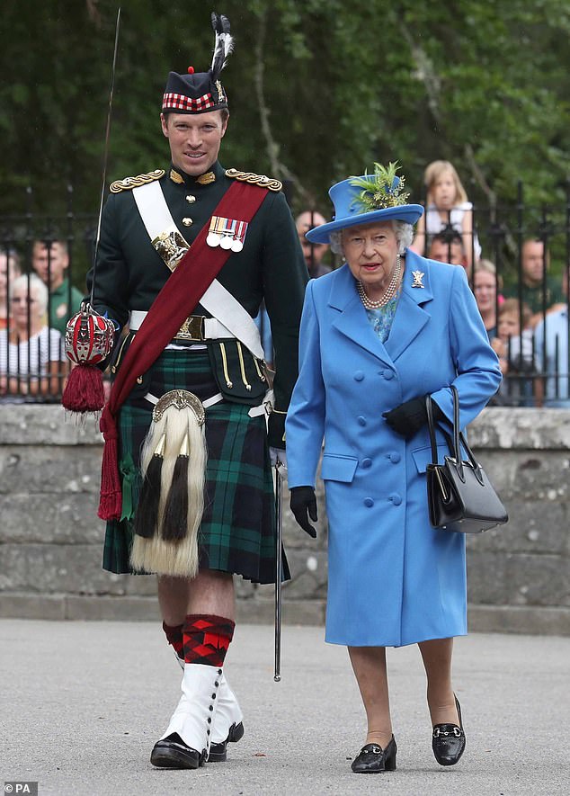 Lieutenant-Colonel Thompson (right) is pictured with the late Queen last year while inspecting the Balaclava Company, 5th Battalion, The Royal Regiment of Scotland, at the gates of Balmoral as she took up her summer residence at the castle.