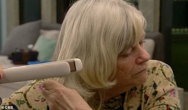 Blink and you'll miss it.  The moment showed Ann holding the straightening iron to her hair, but losing the strands and instead straightening it into the air.
