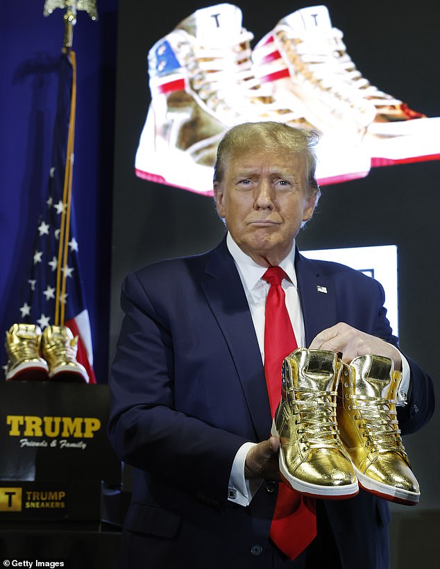 Republican presidential candidate and former President Donald Trump holds a pair of his new line of signature shoes after taking the stage at Sneaker Con at the Philadelphia Convention Center on February 17, 2024 in Philadelphia.