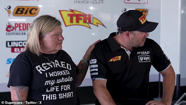 Team owner Betty Klimenko comforts Ryan as he struggles to compose himself in front of the cameras during the interview.