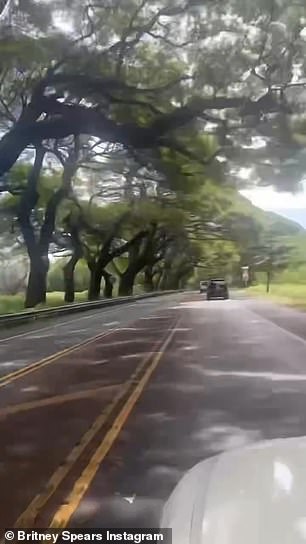 In a clip chronicling her trip, Spears appeared to drop her camera while filming trees along a forested stretch of the road she was driving on.