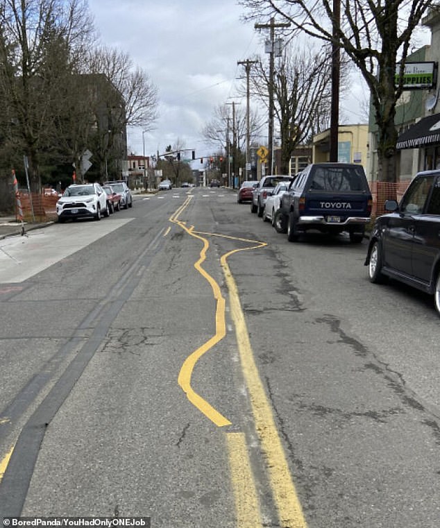A road maintenance worker in the US clearly had a terrible day after painting yellow lines on a completely crooked road.