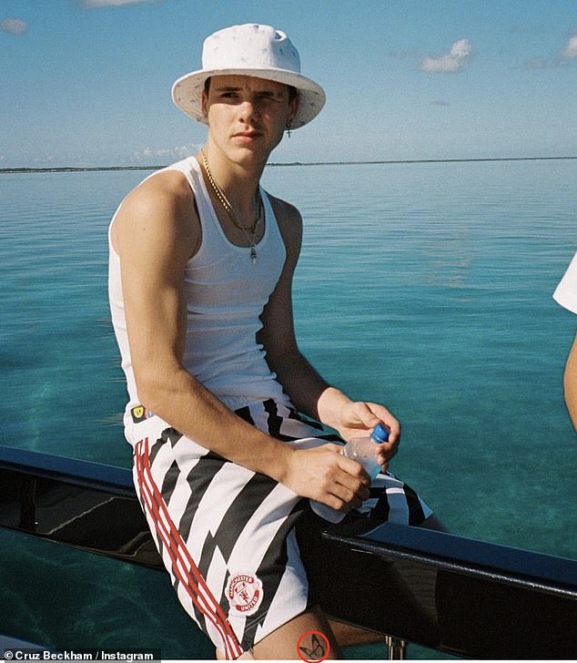 Cruz got his first tattoo at just 16 years old while on vacation in Miami. He debuted the tattoo, a butterfly on his thigh, in an Instagram post in which he saw him sitting on the edge of a boat and looking out to sea.