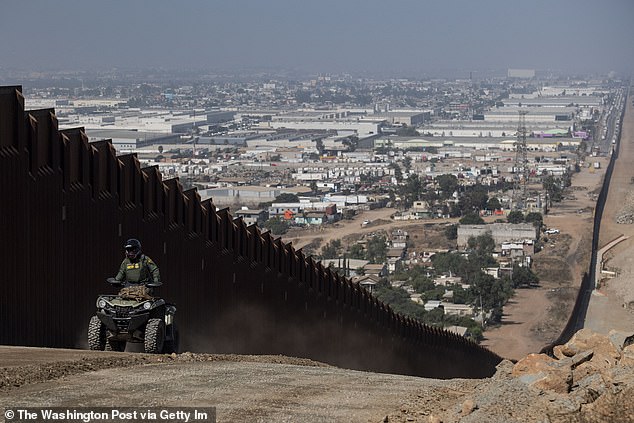 A Border Patrol agent patrols along a secondary border fence construction site that follows the length of the primary border fence separating the United States and Mexico in the San Diego Sector on August 22, 2019.