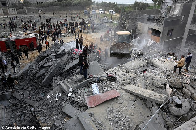 Search and rescue efforts continue to reach injured and dead Palestinians at the scene after Israeli forces attacked and destroyed a building belonging to a Palestinian family in Az-Zawayda, Deir al-Balah, Gaza, on Friday.