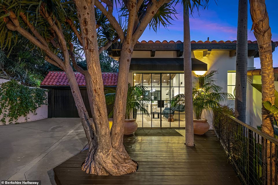 The home boasts incredible views of the city as it is located on just over an acre and tucked away down a semi-private road from Mulholland Drive.