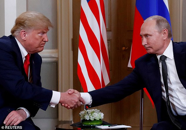 Then-President Donald Trump and his Russian counterpart Vladimir Putin shake hands in Helsinki, Finland, in 2018.