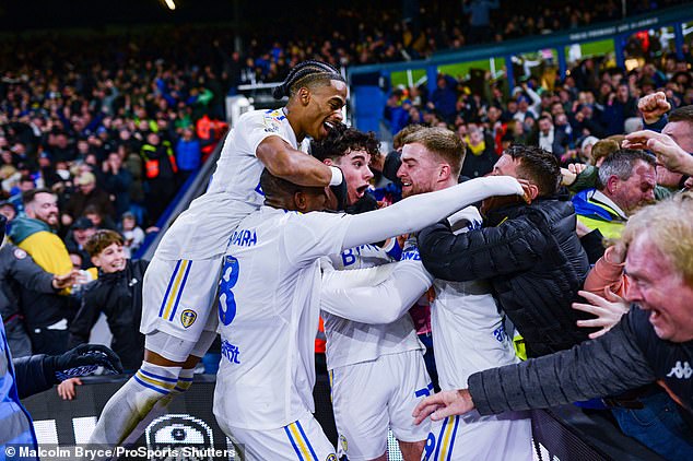 Jubilant Leeds players celebrate after Gray's goal put them ahead against Leicester.