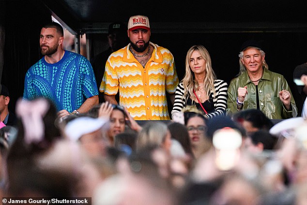 Watching proudly alongside Ross was Taylor's boyfriend Taylor (left), who caused a roar from the crowd when he arrived to see the pop star in action.