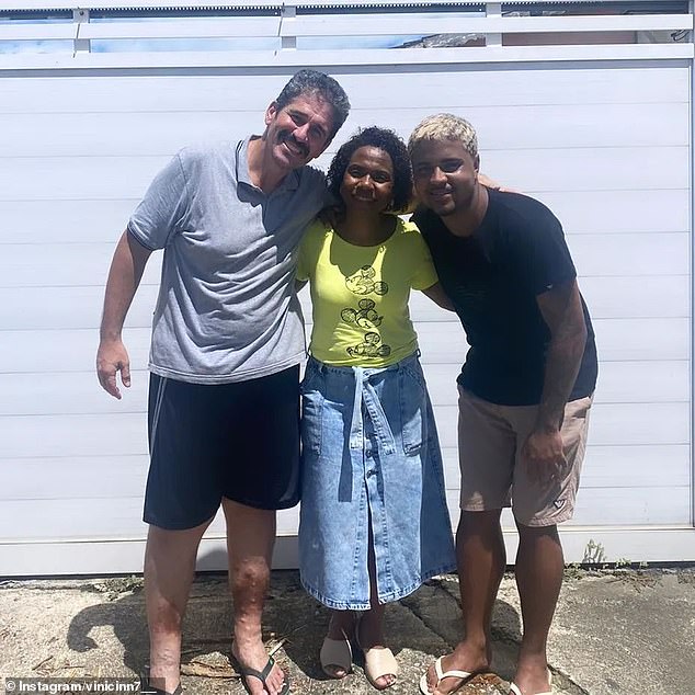 Marcos de Souza (right) met with Jorge Mendes and Berlandia Mendes on Thursday, a day after he saved her and her twin daughters from being swept away by a flood in Rio de Janeiro after she and her children were trapped inside the family car.