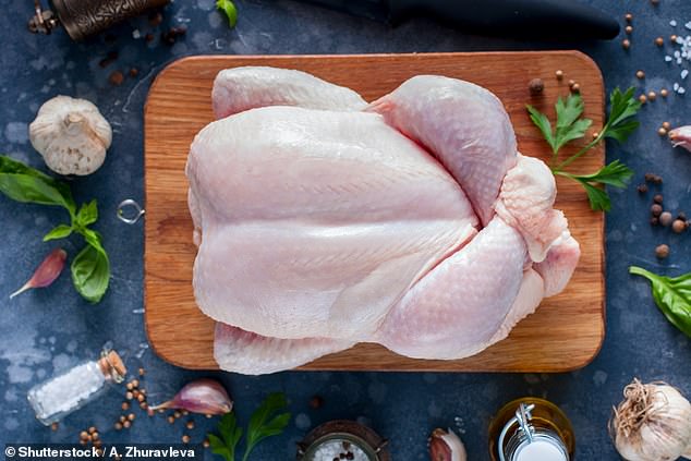 The USDA recommends cooking whole birds to a safe minimum internal temperature of 165°F, measured with a food thermometer (file image)
