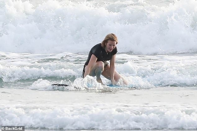 Ellie tests her surfing skills
