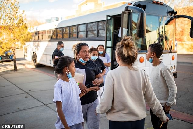 Asylum-seeking migrants are dropped off at Annunciation House in El Paso in December 2022 after being screened by U.S. Customs and Border Protection.
