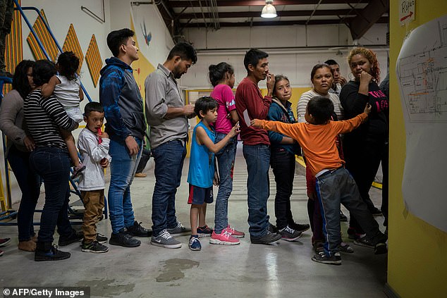 Migrant children from different Latin American countries wait to receive food at a new center opened by Annunciation House to help the large flow of migrants released by the United States Border Patrol and Immigration and Customs Enforcement in El Paso, Texas, on April 24, 2019.