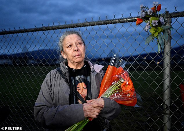 Michelle Pineault brings flowers to remember her daughter Stephanie Lane, one of the victims of the serial killer