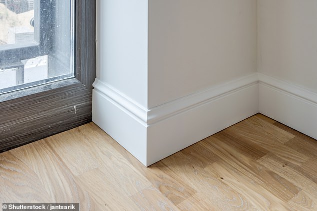 If you don't like the Scottish edges, one option is to slide the laminate under the baseboards to cover the expansion gaps.
