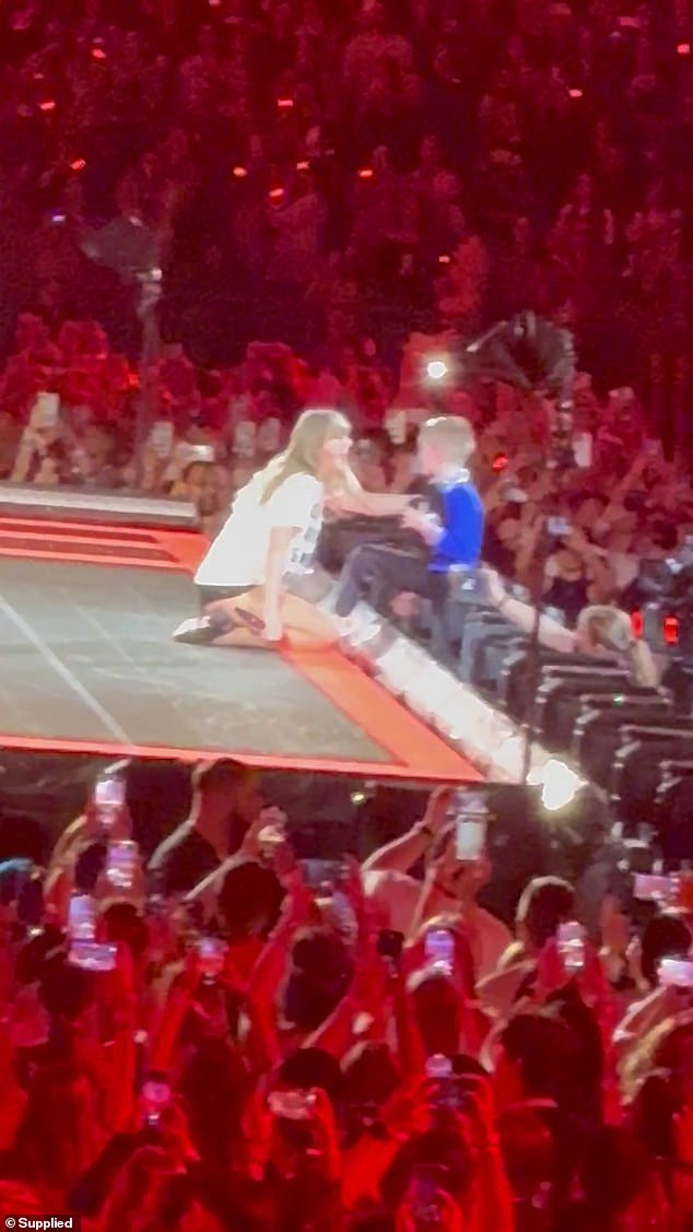 And on Saturday, one child sang and danced vigorously as he was invited up on stage to receive the special '22 hat' gift that Taylor gives to one lucky fan each concert night.