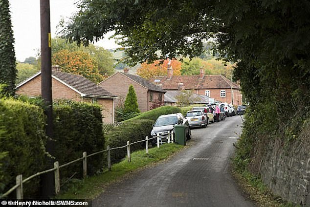 The dispute has left residents of the picturesque Wiltshire village (pictured) in an uproar.