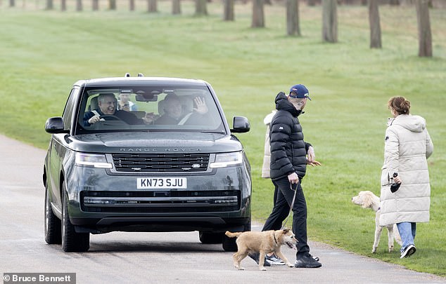 Later, the prince was in a much better mood as he drove through Windsor, this time accompanied by a friend.