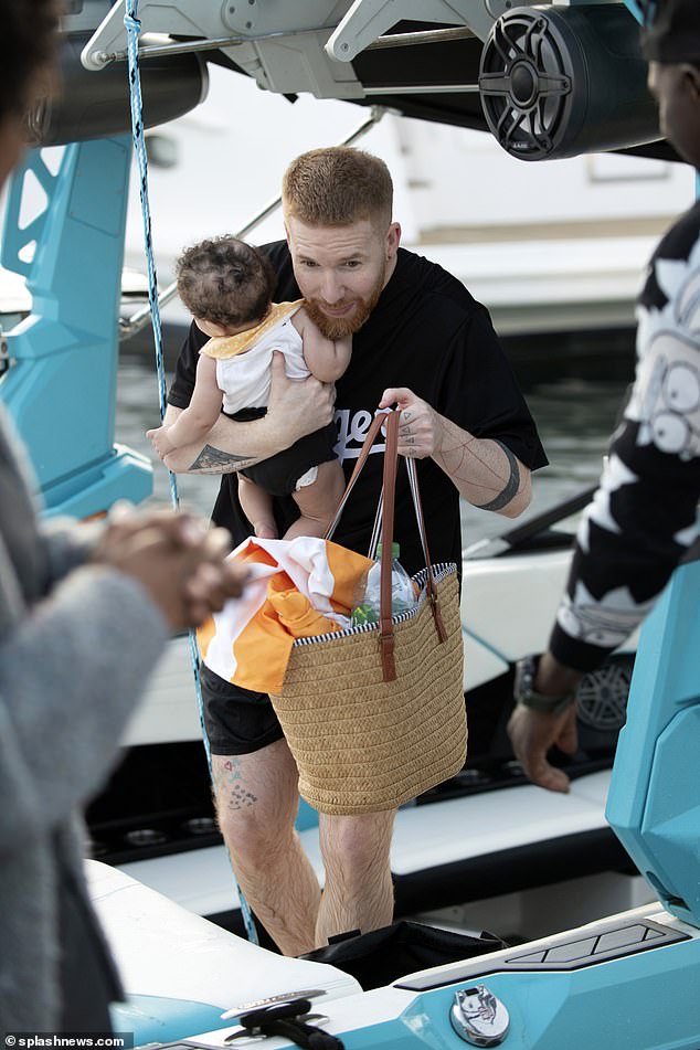 Neil brought a beach bag with essentials to the boat.