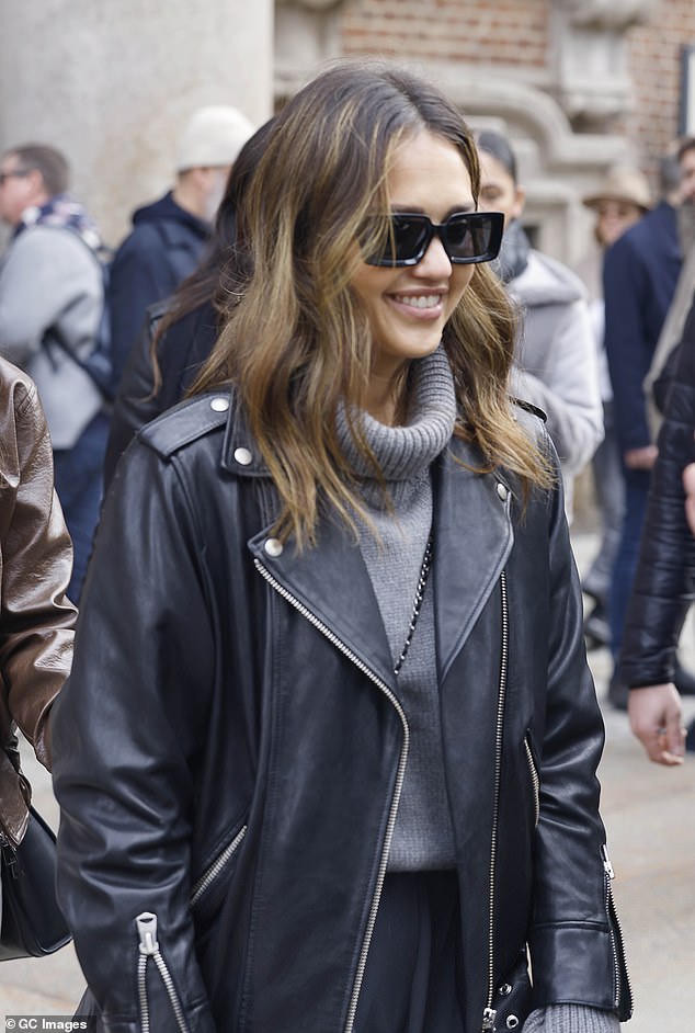 In keeping with her greyscale color palette, Jessica topped off her showstopping outfit with a pair of classic black shades and styled her brunette tresses in loose waves.