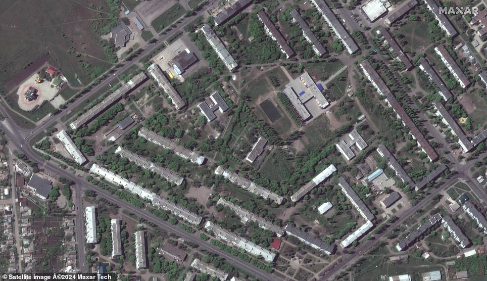 Satellite photographs released by Maxar Technologies show school number 12 and apartment buildings in the eastern city of Bakhmut, Donetsk Oblast, on May 8, 2022.
