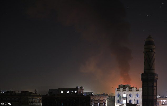 The joint operation targeted weapons storage facilities, drones, air defense systems, radars and a helicopter, as well as other unmanned surface vehicles and submarines. Pictured: Smoke over Sana'a, Yemen, on February 24, 2024.