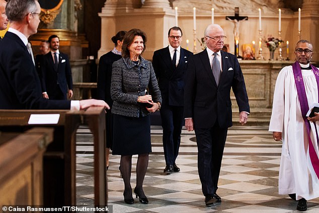 Queen Silvia, 80, wore a gray and blue patterned ensemble and kept her brown hair in its typical tousled style.