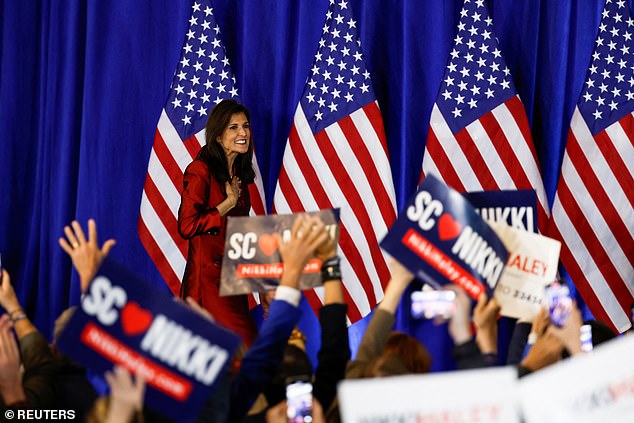 The Republican presidential candidate greets supporters as she arrives at her primary night party in Charleston, South Carolina. She told the crowd that about 40 percent of the votes she received in her home state were enough to continue.
