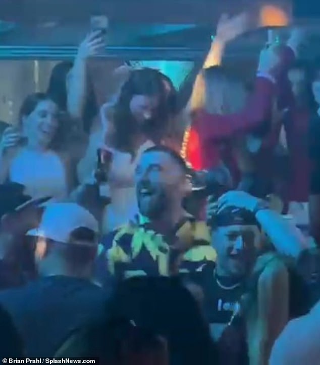 Kelce was partying with Chiefs quarterback and close friend Partick Mahomes (below right)