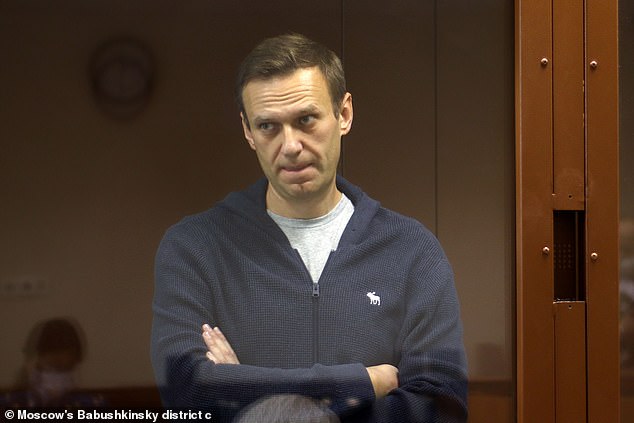 Alexei Navalny, pictured in court in 2021, died suddenly on February 16 after a walk, according to Russia. His shocking death at age 47 has led critics to blame Putin for his direct involvement.