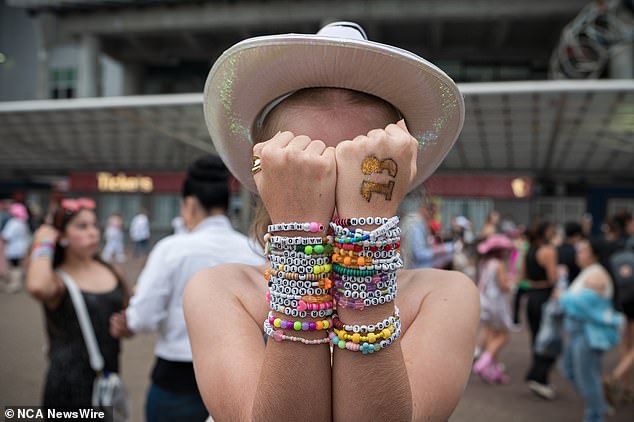 A concertgoer wearing friendship bracelets attends the second of four Taylor Swift Eras tour dates at Sydney's ACCOR stadium.