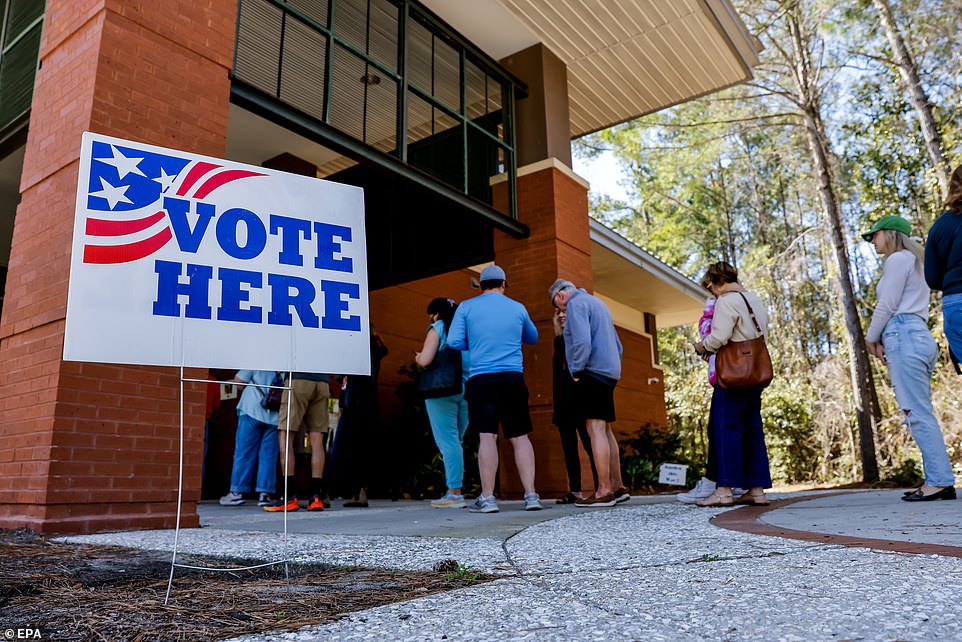 Voters line up to cast their ballots in the South Carolina Republican presidential primary on John's Island, South Carolina, on Saturday, February 24.
