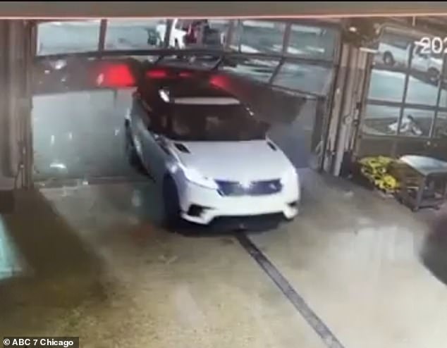 Footage shows one of the thieves rapidly accelerating a white car towards a glass garage door.