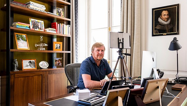 During lockdown, King WIllem-Alexander shared a look inside his home office as he works from home amid the coronavirus pandemic, and revealed he keeps a photograph with Queen Elizabeth in his study.