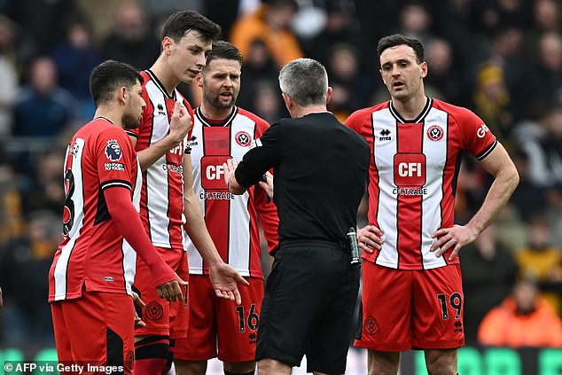 Referee Darren Bond spoke to Robinson and the VAR checked a possible red card against Souza.