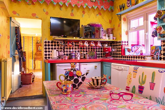 Pictured: Mary's multi-colored kitchen also features a black and white checkered backsplash and yellow walls.
