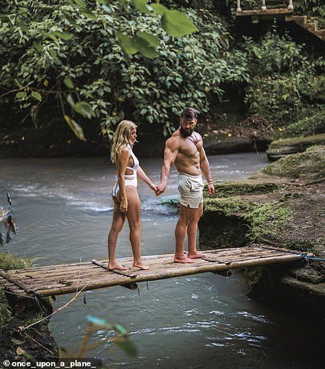 Above, the couple walks hand in hand as they explore Bali's lush green forests.