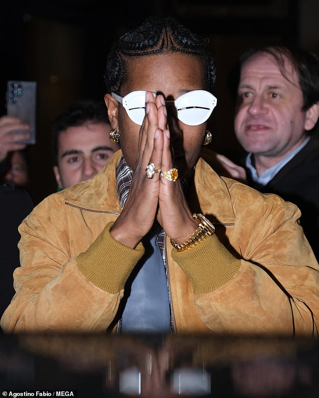 A$AP rocked a large pair of chunky gold earrings, two huge diamond rings, and a matching Rolex watch.