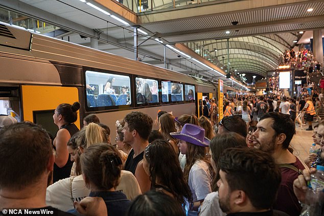 Crowds, which also included Blink-182 fans from a concert at neighboring Qudos Bank Arena, were seen entering the station before being transported to trains.