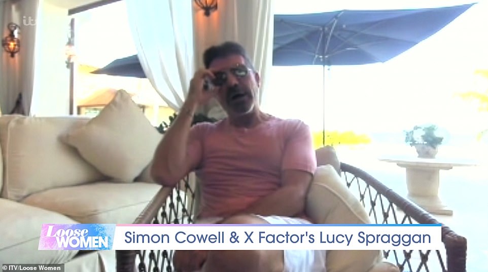 2022: More questioning eyebrows were raised just days later when Cowell's face was curiously obscured by a shadow as he praised his eight-year-old son Eric during a remote appearance on ITV chat show Loose Women.
