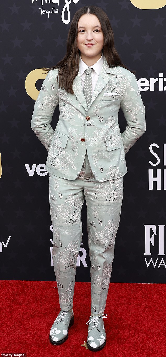 The Last Of Us' Bella Ramsey looked great in a floral suit and tie combo at the Critics Choice Awards in January.