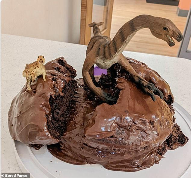 Intelligent! A Michigan dad used his quick thinking to make this cake disaster look intentional after adding dinosaurs.