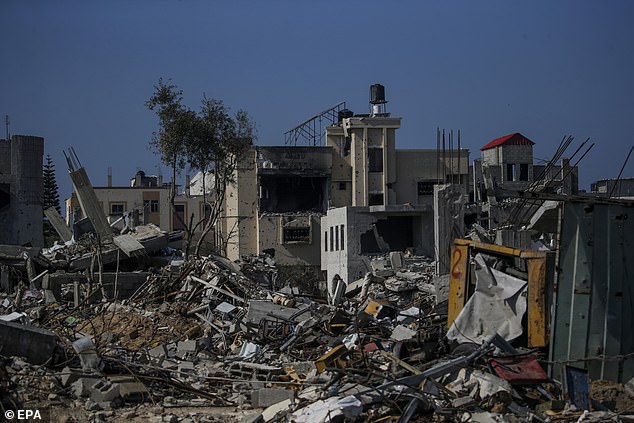 Destroyed Palestinian houses in the Al Nusairat refugee camp in the southern Gaza Strip on Sunday