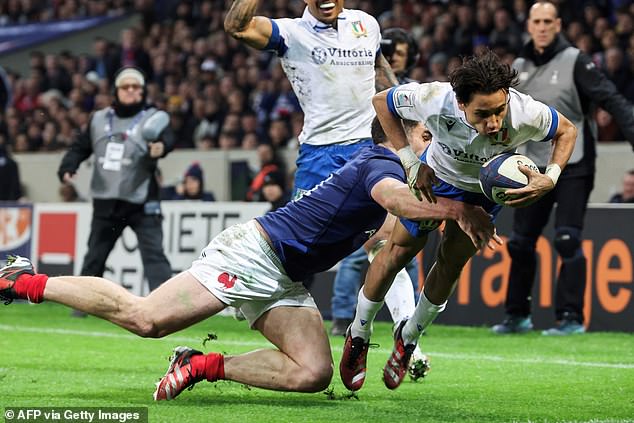 Ange Capuozzo scored Italy's try after the break against several Toulouse teammates