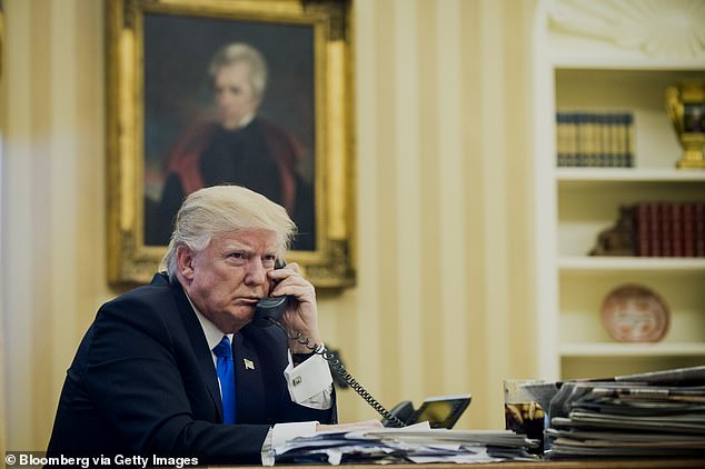US President Donald Trump speaks on the phone with Malcolm Turnbull during their first official telephone conversations at the White House in Washington, DC.