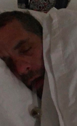 An image of Hunter Biden's abandoned hard drive shows him passed out with a crack pipe dangling from his mouth.