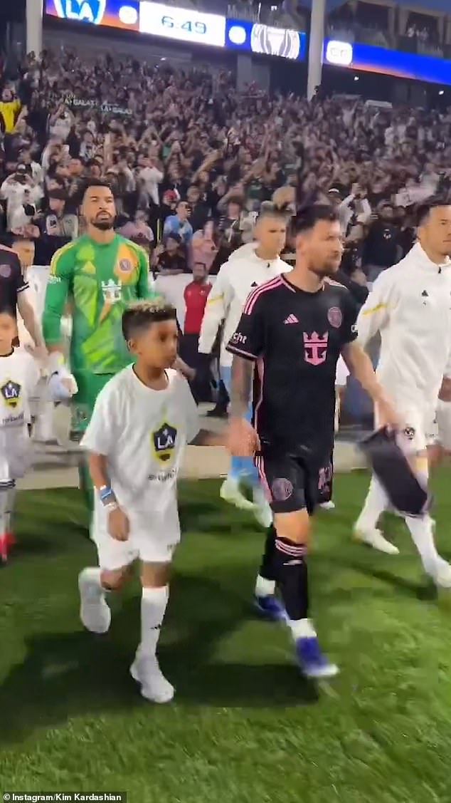 The eight-year-old held Messi's hand before Inter Miami's 1-1 draw against LA Galaxy