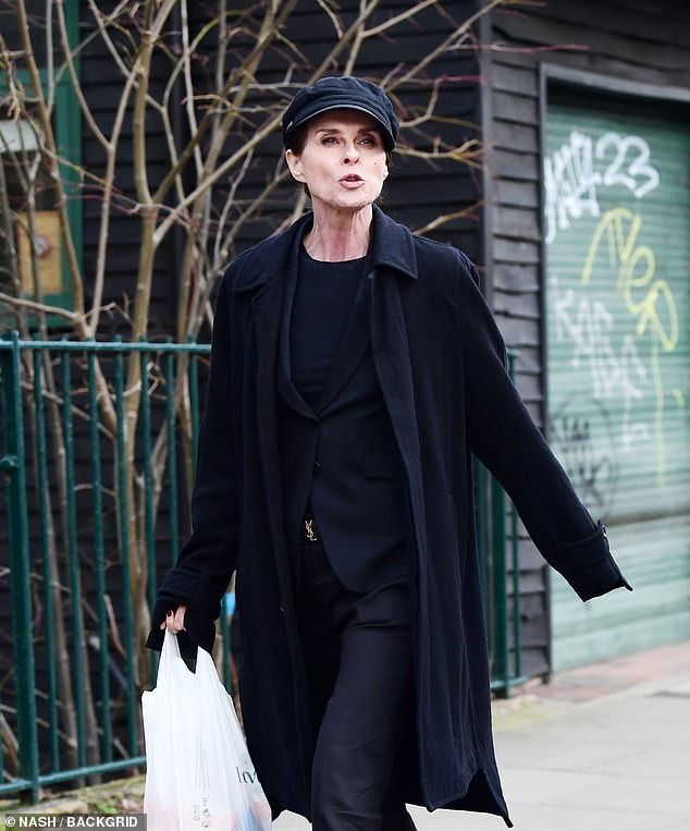 The '90s pop star looked chic in an all-black ensemble as she was spotted with the producer.